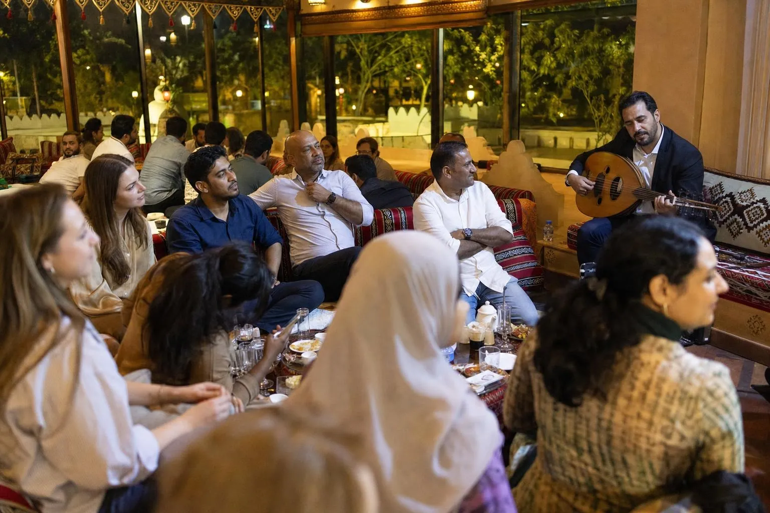 A team mid-programme on Iftar Together — Dubai, Abu Dhabi or Sharjah, hotel, majlis venue or tented setup.