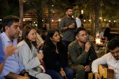 A team mid-programme on Majlis & Fire — Sharjah, Umm Al Quwain or Ras Al Khaimah, private farmhouse, exclusive use.