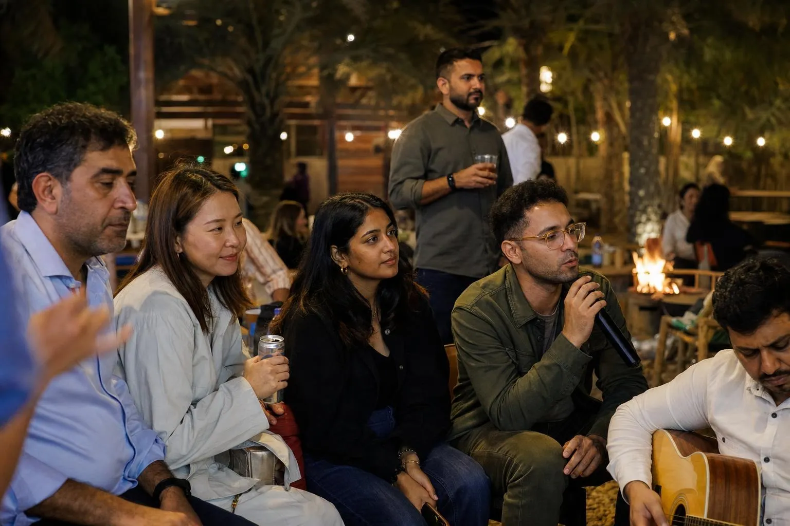 A team mid-programme on Majlis & Fire — Sharjah, Umm Al Quwain or Ras Al Khaimah, private farmhouse, exclusive use.