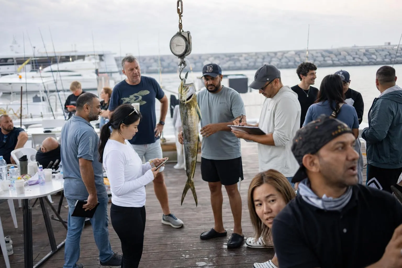 A team mid-programme on Open Water — Dubai, Jumeirah or Dubai Marina fishing harbour, offshore.