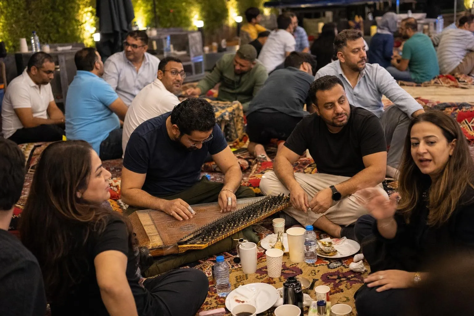 A team mid-programme on Suhoor Majlis — Dubai, Sharjah or Abu Dhabi, hotel terrace, garden or the client's own outdoor space.