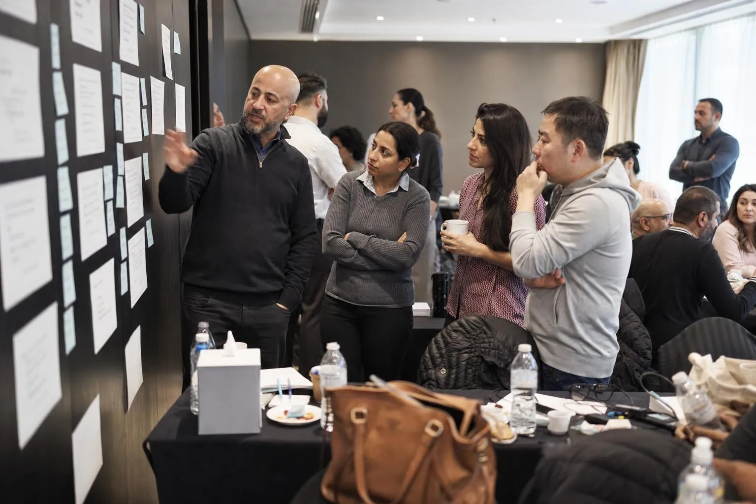 A team mid-programme on The Alignment Day — Dubai or Abu Dhabi, 4★ hotel meeting suite, off the client's own premises by design.