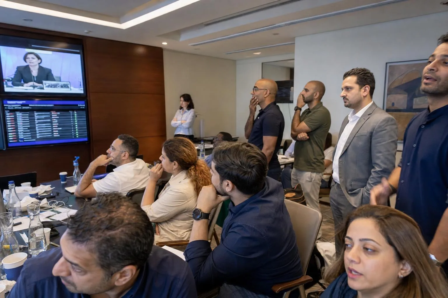 A team mid-programme on The Crisis Room — Dubai or Abu Dhabi, hotel conference floor with a main room and three breakouts.