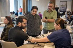 A team mid-programme on The Reset — Dubai, hotel wellness floor or a dedicated studio; or delivered at the client's own office.