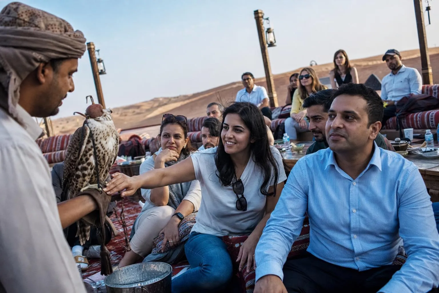 A team mid-programme on Under the Stars — Dubai or Sharjah inland, private licensed desert site, not a commercial camp.